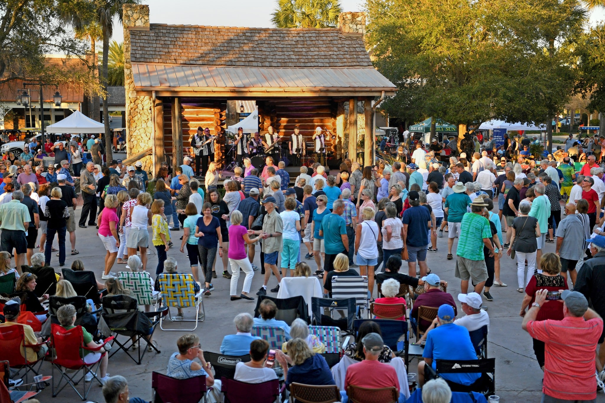 Arianna Bennett / Daily Sun - The crowd dances to the music of Rocky and the Rollers at Market Night at Brownwood Paddock Square on Thursday, February 3, 2022.